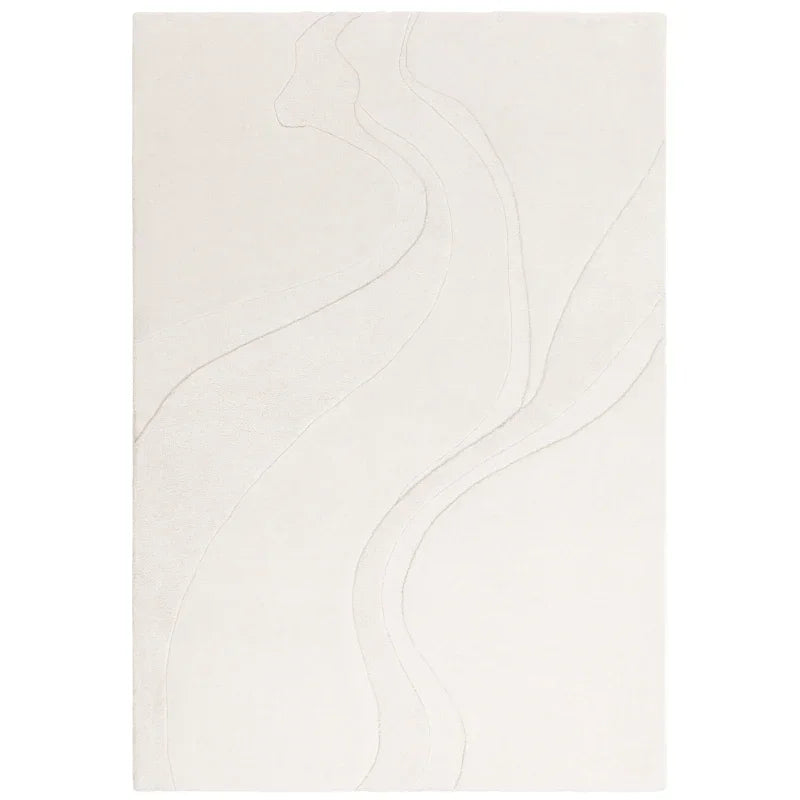 Ivory area rug with subtle raised abstract pattern and textured lines