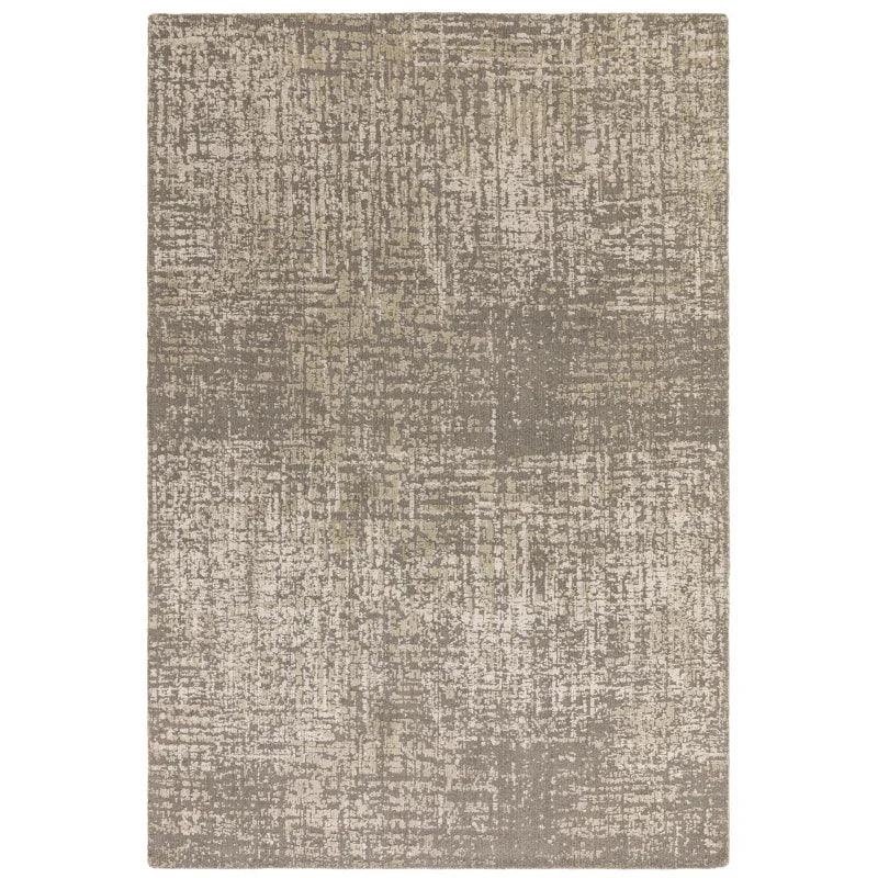 Beige abstract patterned rug with textured finish and rectangular shape