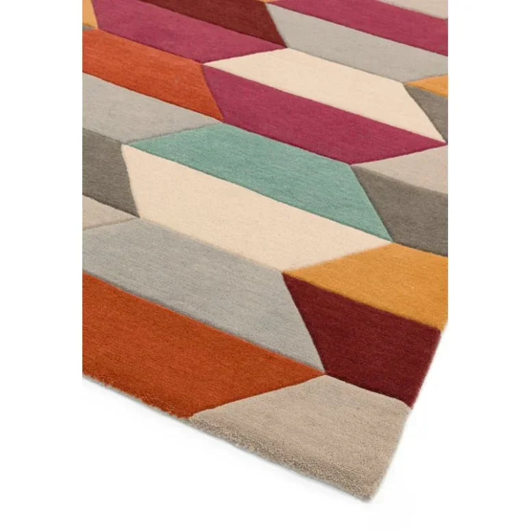 Multicoloured geometric wool rug with bold 3D diamond pattern, corner view
