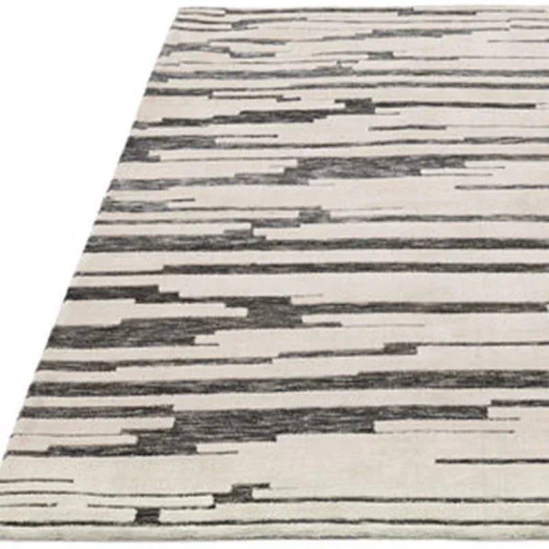 Modern area rug with grey linear pattern on a light background, angled view