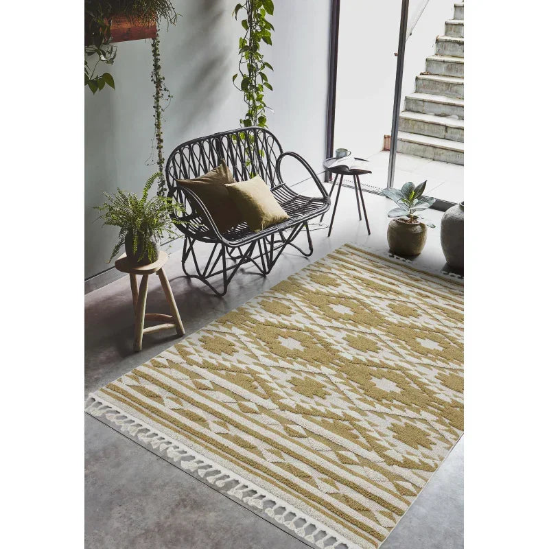 Geometric beige and white rug in modern living room with black rattan sofa and green plants