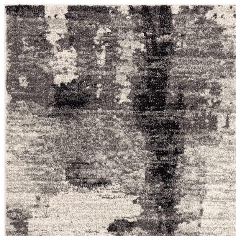 Abstract grey and white area rug with modern distressed pattern