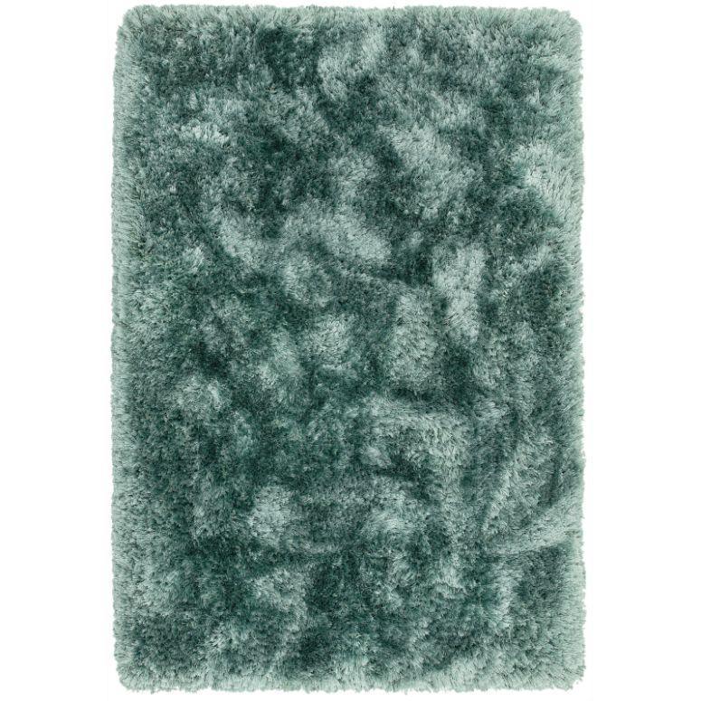 Rectangular green shaggy rug with dense pile and soft textured surface