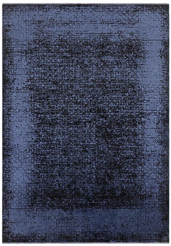 Large rectangular blue area rug with distressed textured pattern