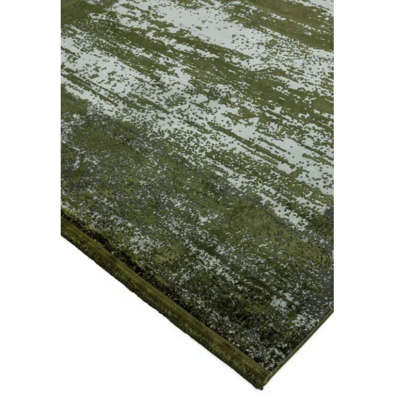 Green modern area rug with abstract pattern and textured finish, corner view