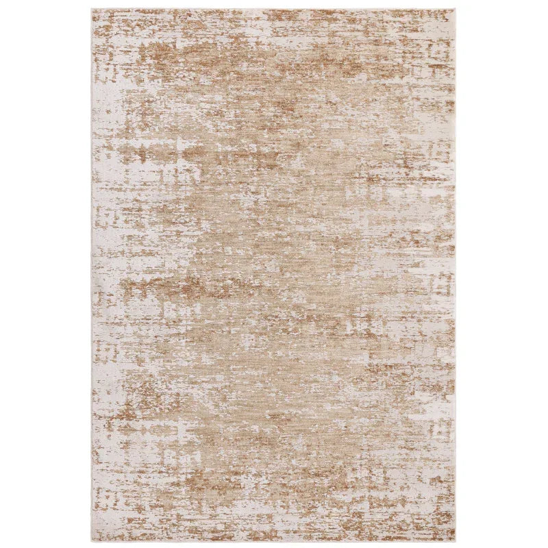 Beige distressed area rug with abstract pattern in a rectangular shape