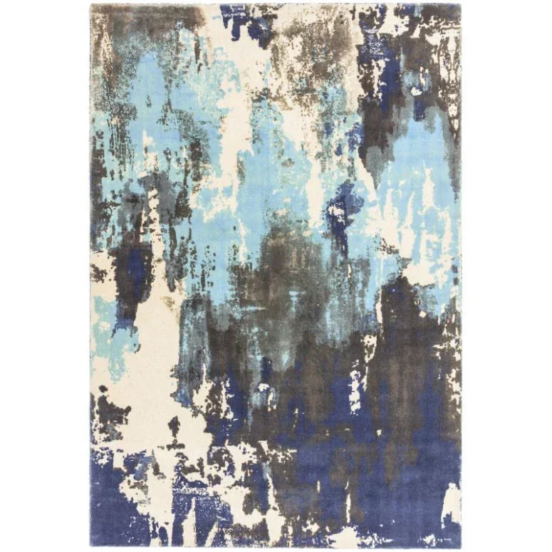Modern area rug with abstract blue, cream, and grey pattern for living room or bedroom
