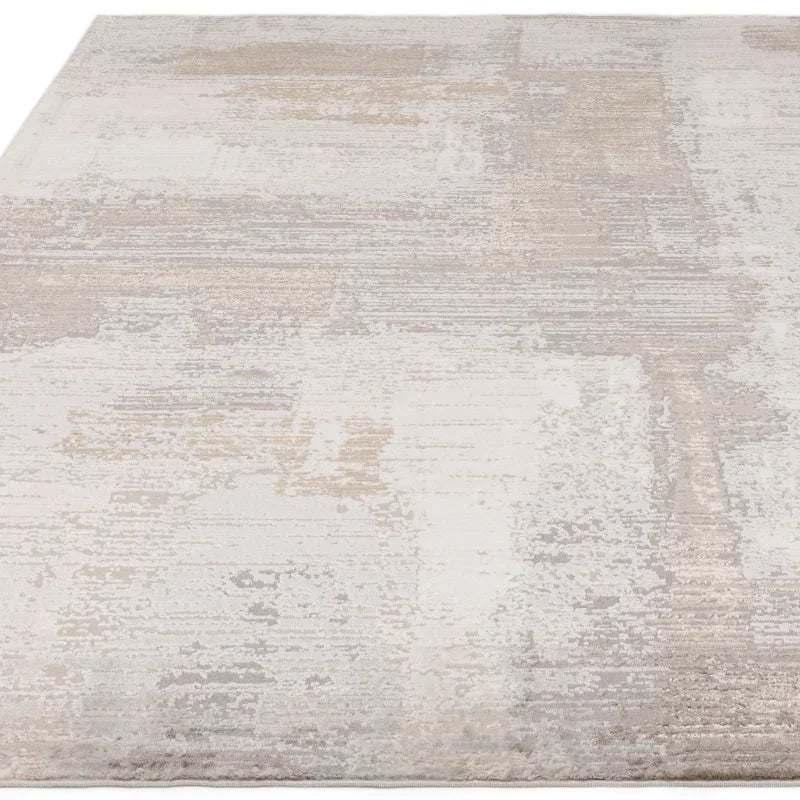Modern beige abstract area rug with textured pattern and soft pile