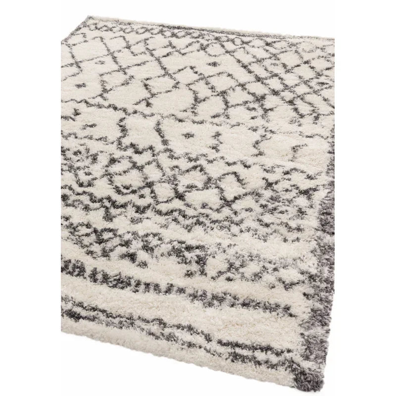 cream shaggy rug with grey geometric pattern and thick pile, corner view
