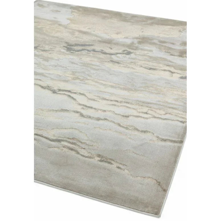 Modern beige area rug with abstract pattern and soft texture, shown from angled corner view