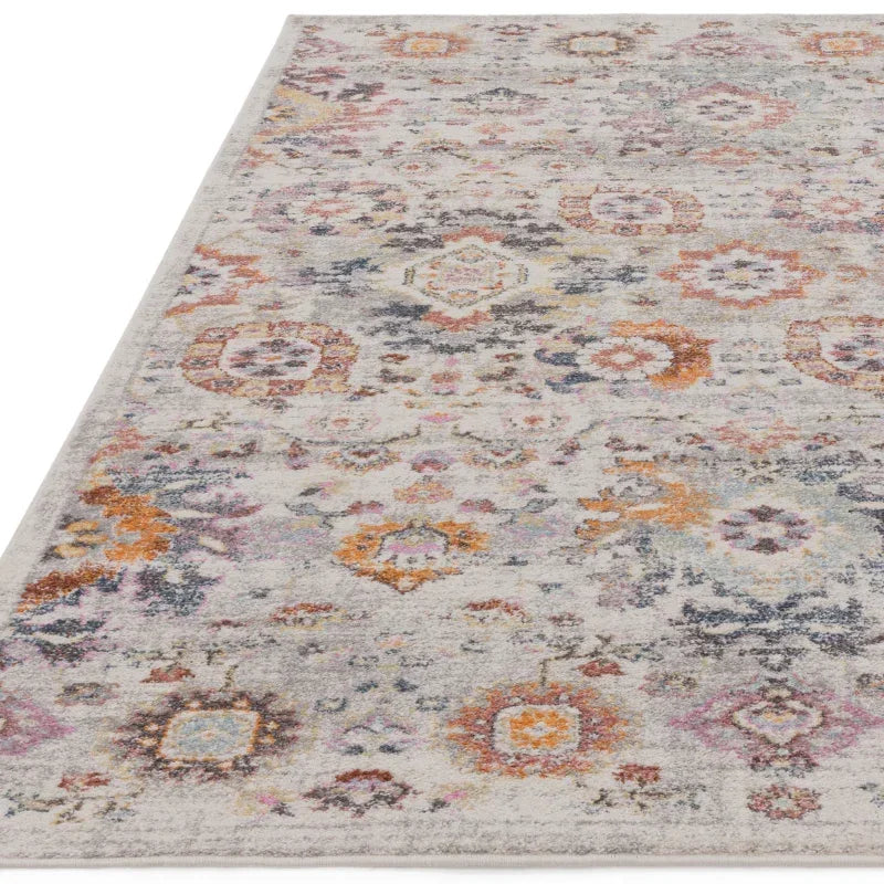 Multicolour patterned area rug with distressed design on a light background