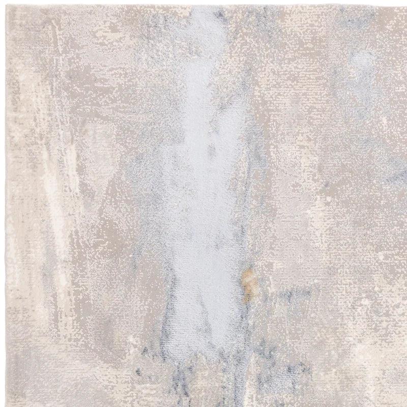 Abstract beige and grey area rug with textured pattern and soft finish