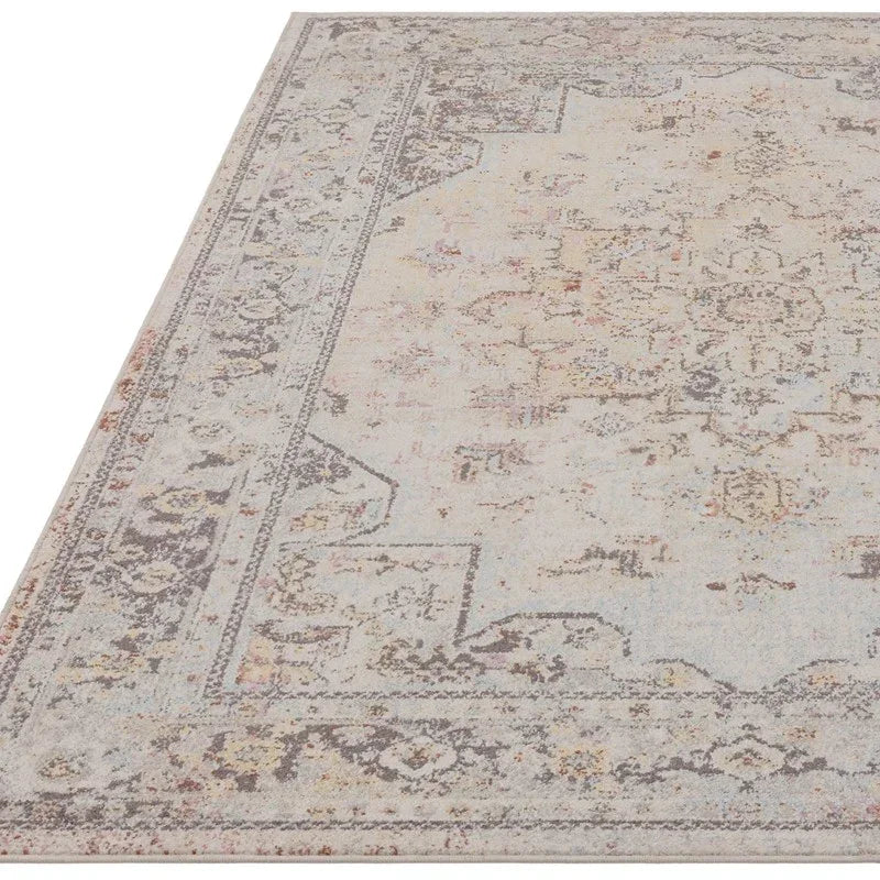 Vintage patterned area rug in light beige and grey with ornate border design
