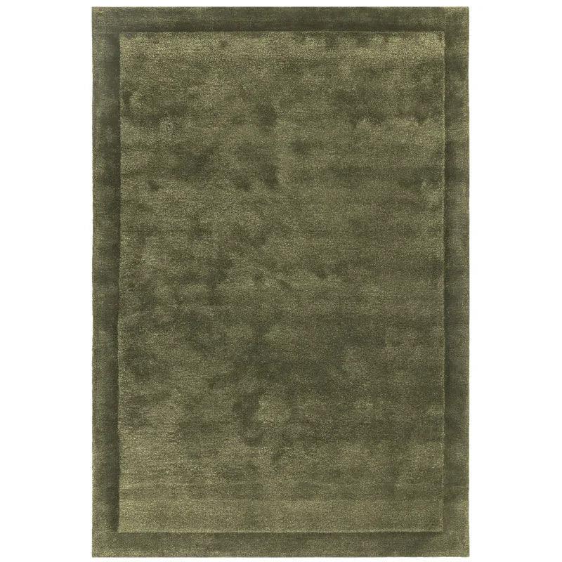 Olive green area rug with subtle border pattern and soft texture