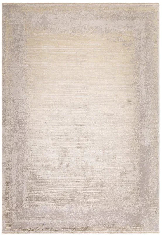 Beige textured area rug with subtle border pattern and distressed finish
