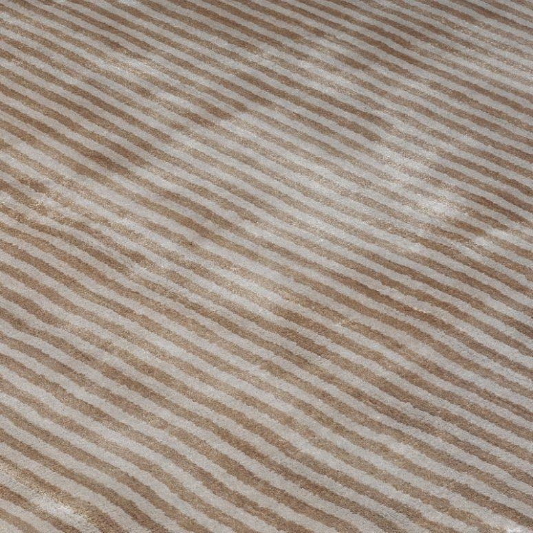 Beige striped rug with soft textured surface and diagonal line pattern