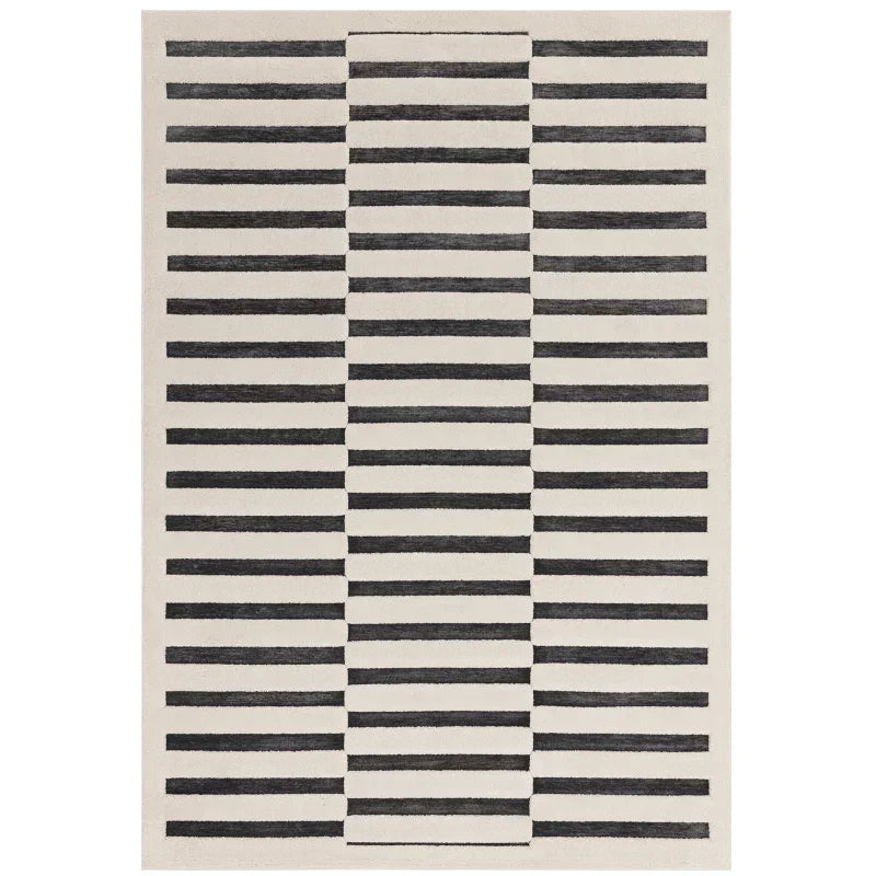 Modern area rug with black horizontal stripes on a cream background, rectangular shape