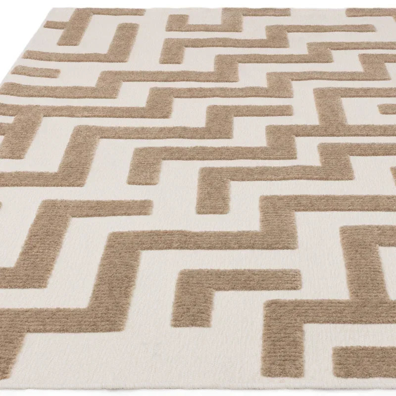 beige and cream geometric patterned rug with textured raised design