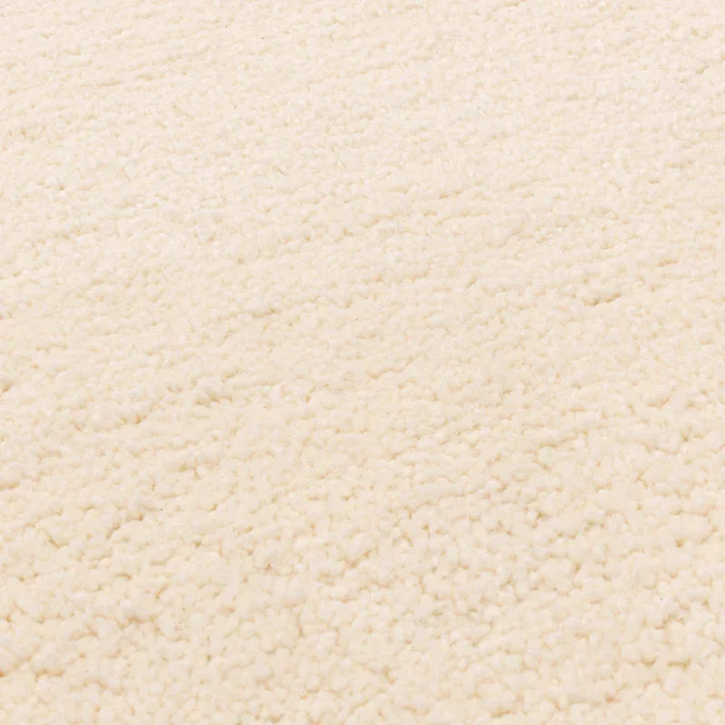 Close-up of cream boucle fabric texture for sofa or armchair upholstery