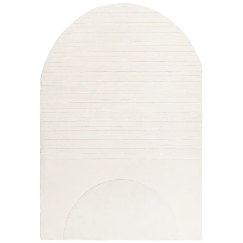 Cream arch shaped rug with subtle horizontal textured lines and geometric detail