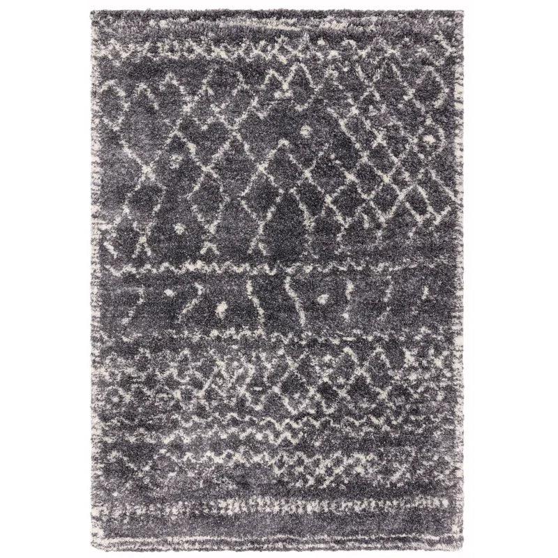Grey patterned area rug with white geometric designs and soft textured pile