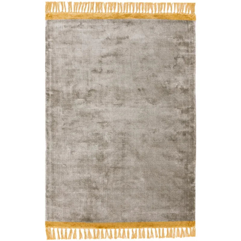 Grey velvet area rug with yellow fringe border on both ends