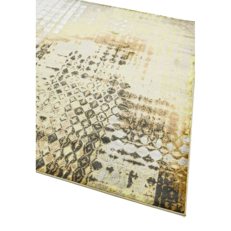 Beige patterned area rug with abstract geometric and faded design detail, angled corner view