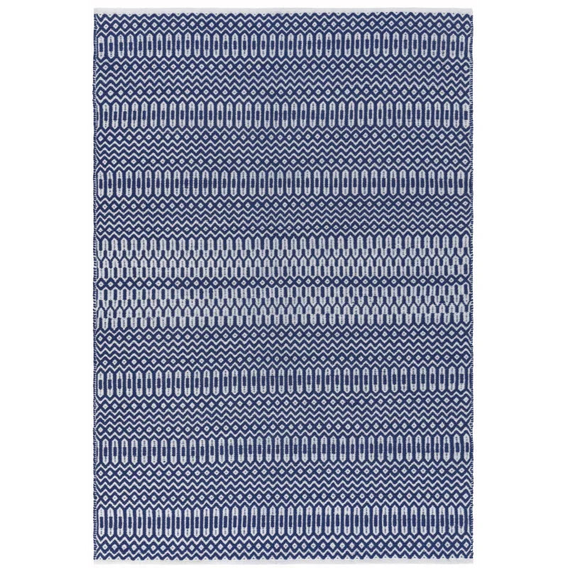 Blue and white geometric patterned rug with textured woven design