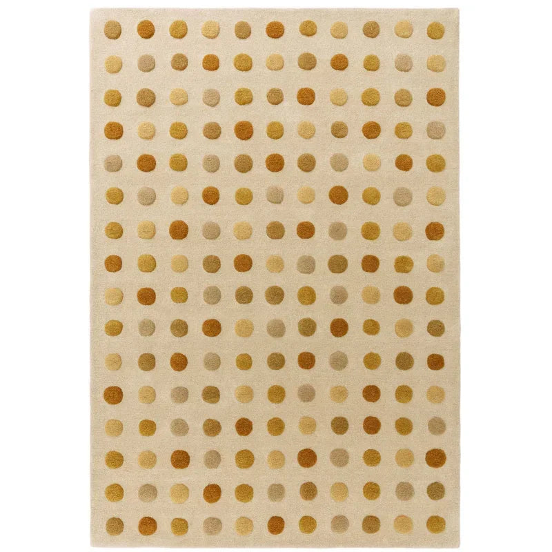 Beige area rug with gold and brown polka dot pattern, rectangular design