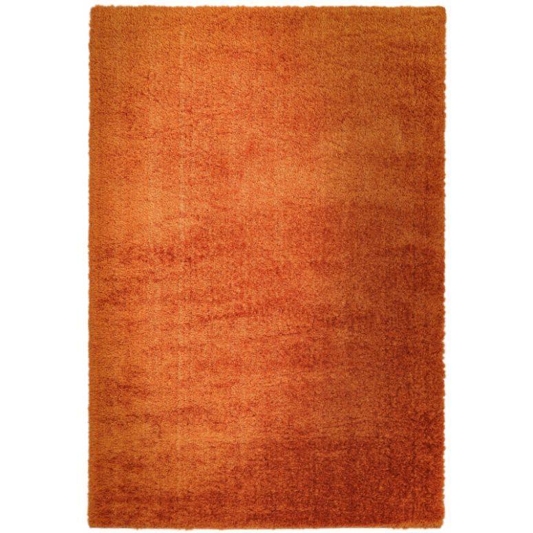 Rectangular orange shaggy rug with dense pile and soft texture, shown from above