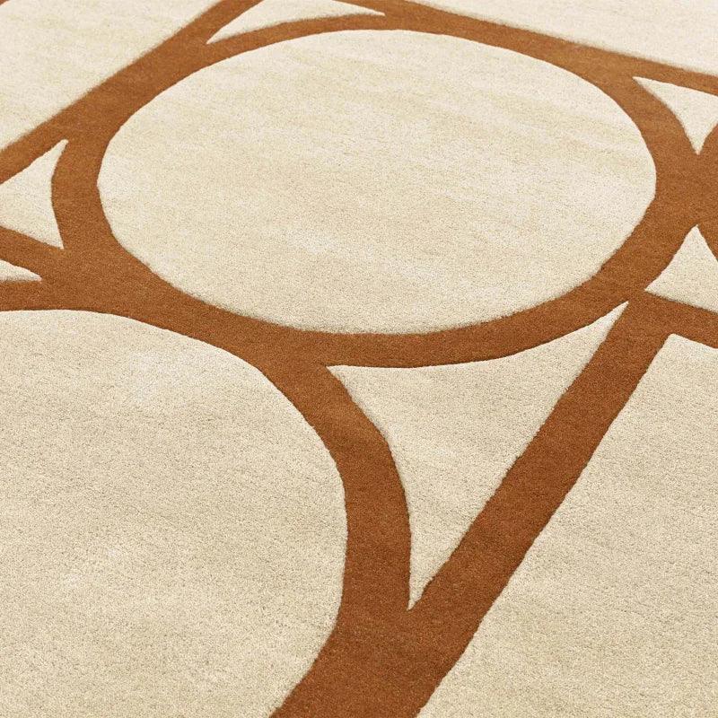 Beige and brown geometric pattern rug with intersecting circles and lines