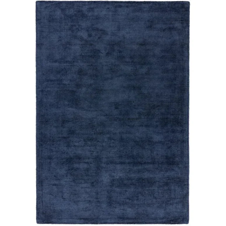 Navy blue area rug with plush texture and rectangular shape