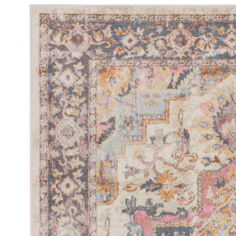 Corner detail of multicolour patterned area rug with floral and geometric border