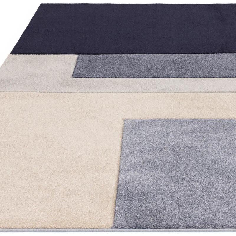 Modern geometric area rug with navy, grey and cream rectangles