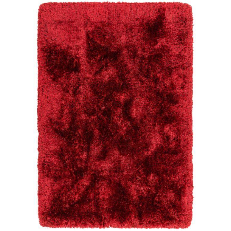 Rectangular red shaggy rug with thick pile texture shown from above