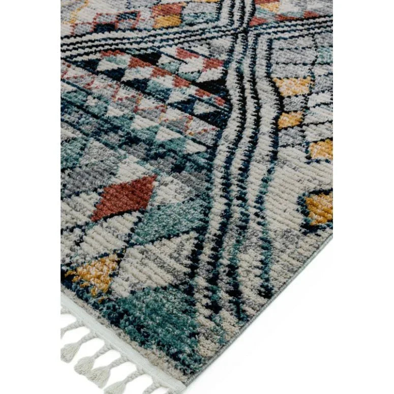 Patterned area rug with diamond and geometric shapes in blue, yellow, and orange, tassel edge
