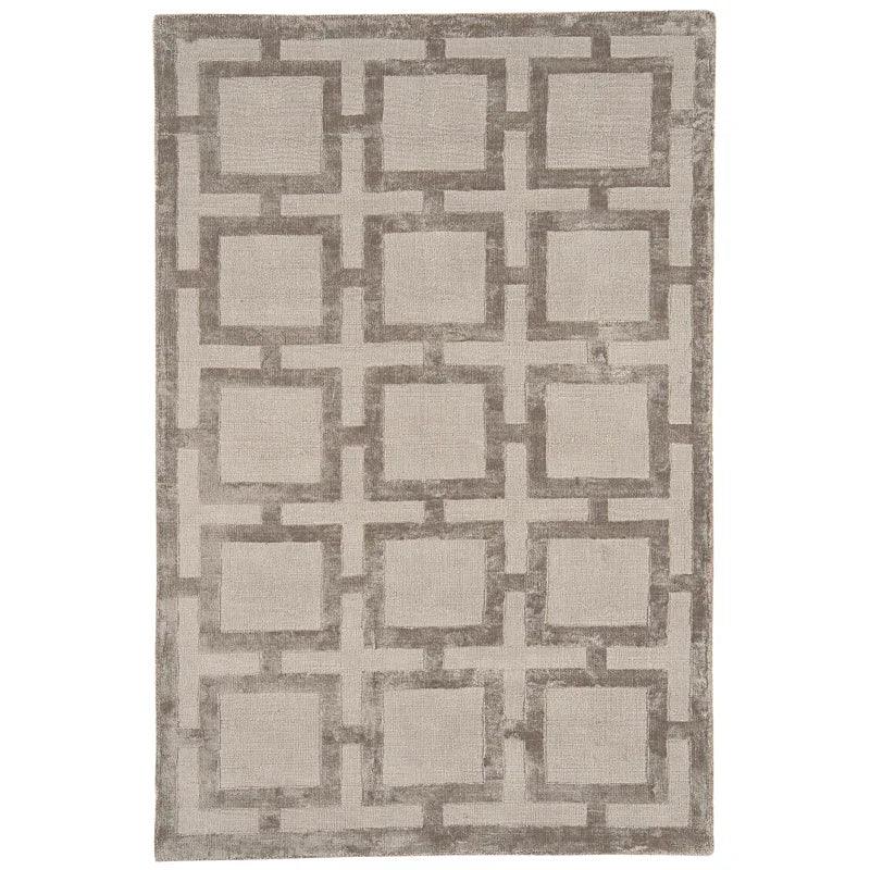 Beige geometric area rug with raised square pattern and textured finish