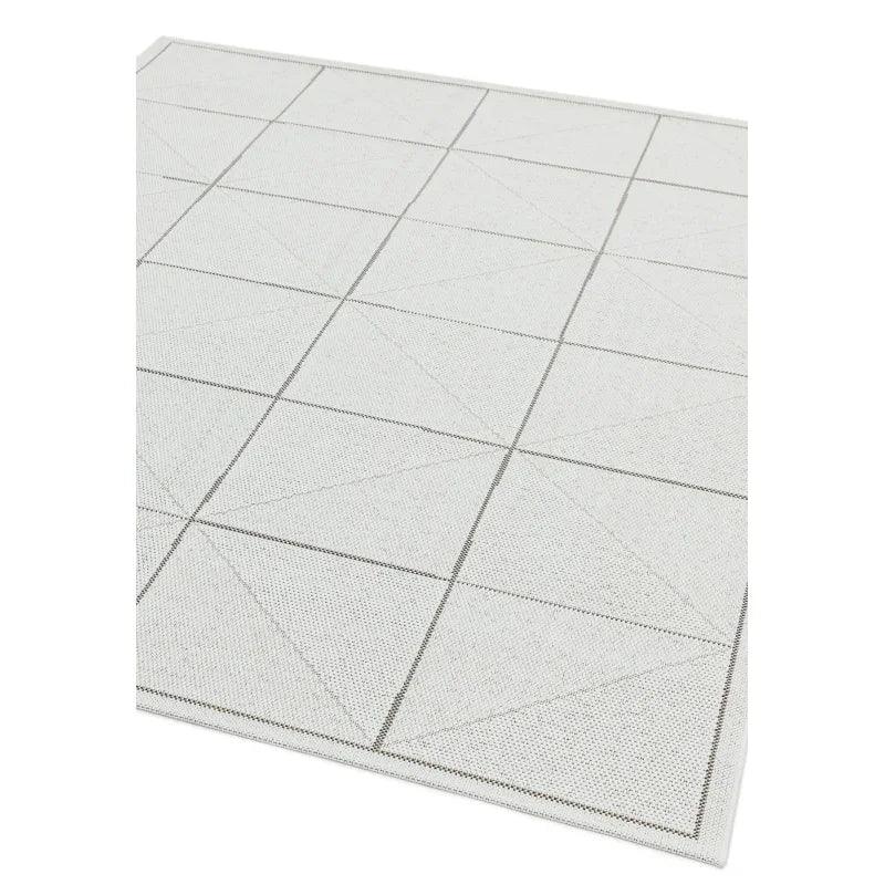 Light grey geometric area rug with subtle square and triangle pattern
