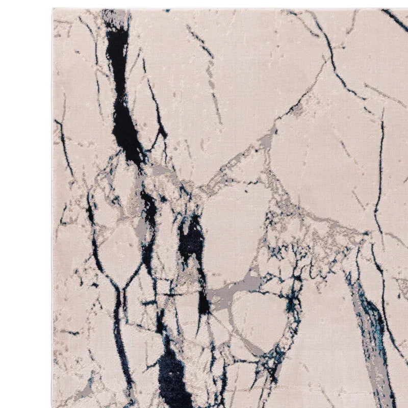 Modern abstract rug with cream base and black marble pattern detail