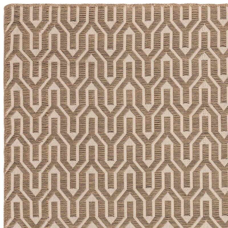 Beige geometric pattern rug with textured woven detail, close corner view