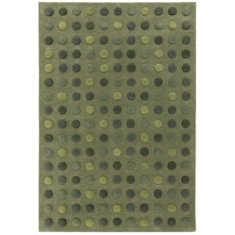 Green wool rug with raised polka dot pattern in various shades of green