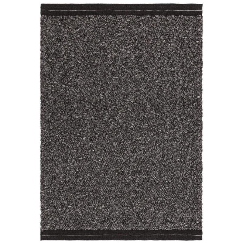 Charcoal textured area rug with solid black border, rectangular shape, overhead view