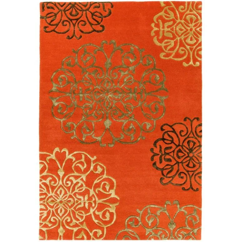 orange area rug with gold and black floral medallion pattern