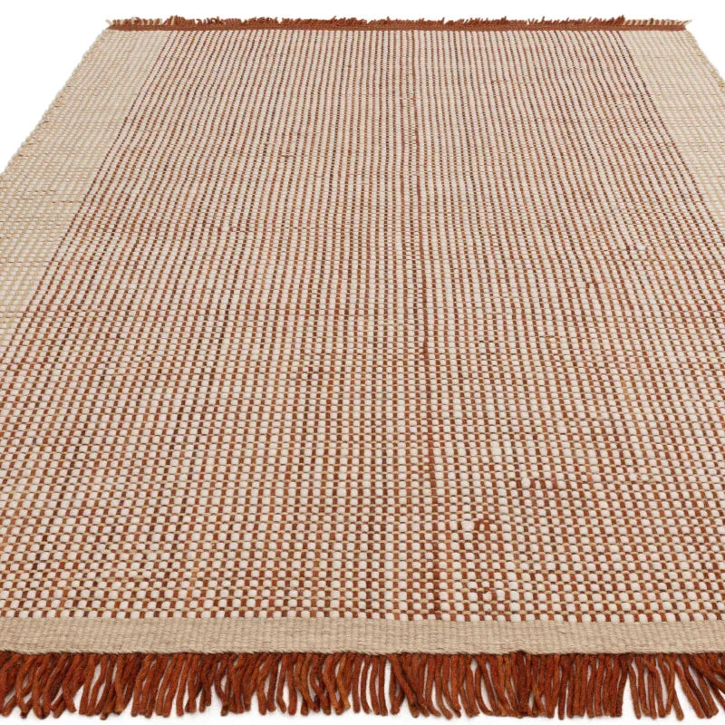 Brown and cream woven rug with fringe edges, rectangular area rug, overhead view
