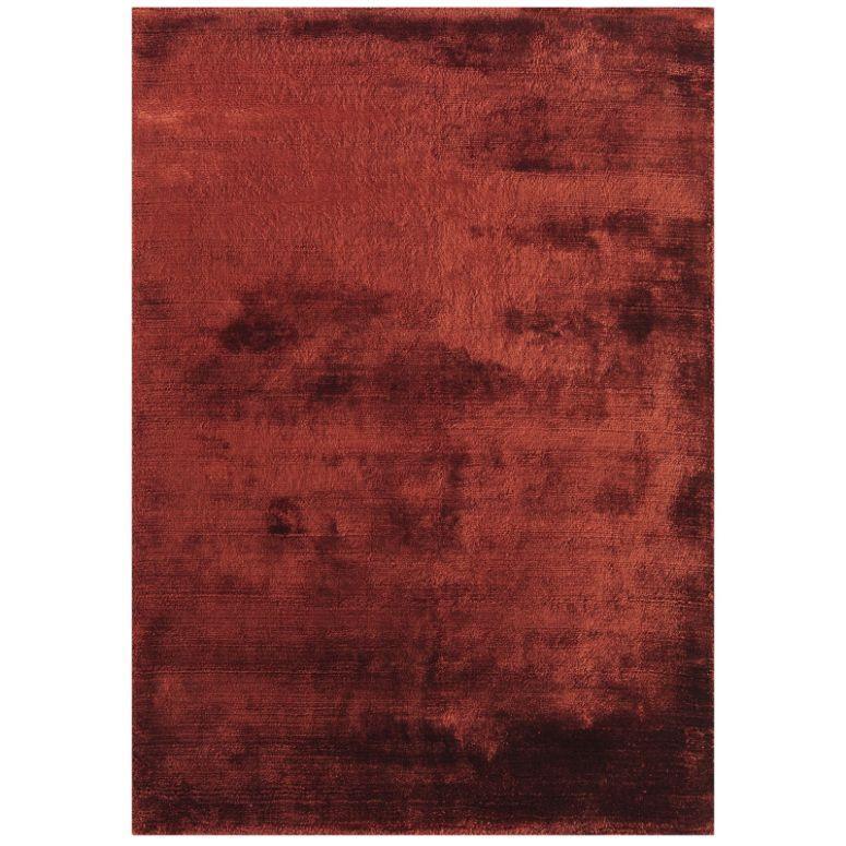 Plush burgundy area rug with soft, velvety texture and minimal pattern