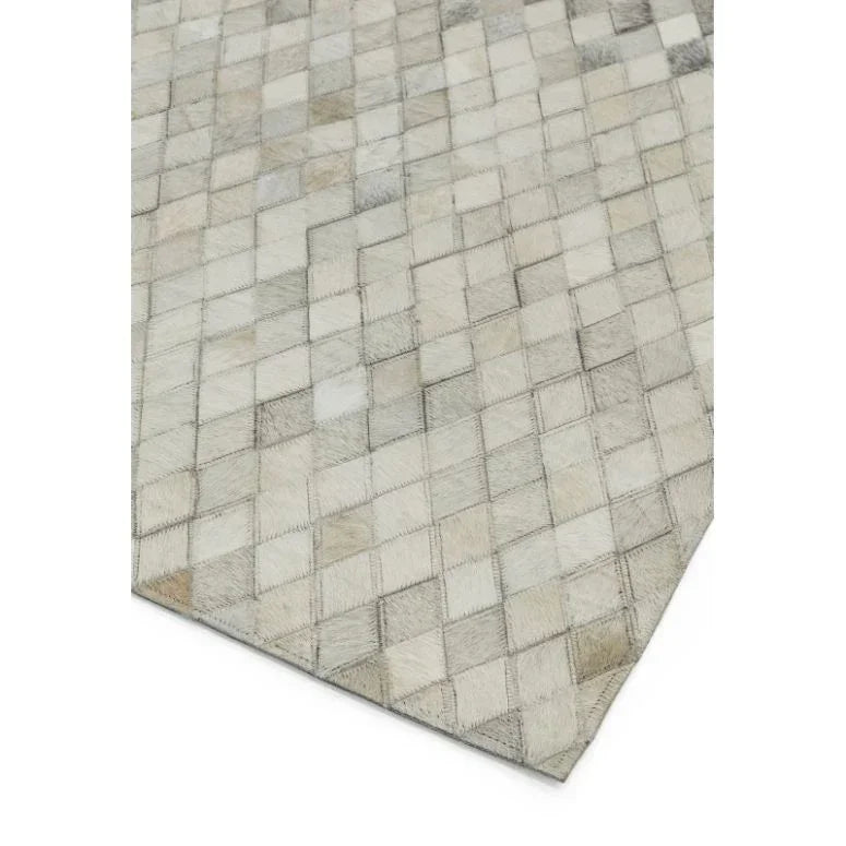 Beige geometric pattern rug with stitched diamond design and textured finish