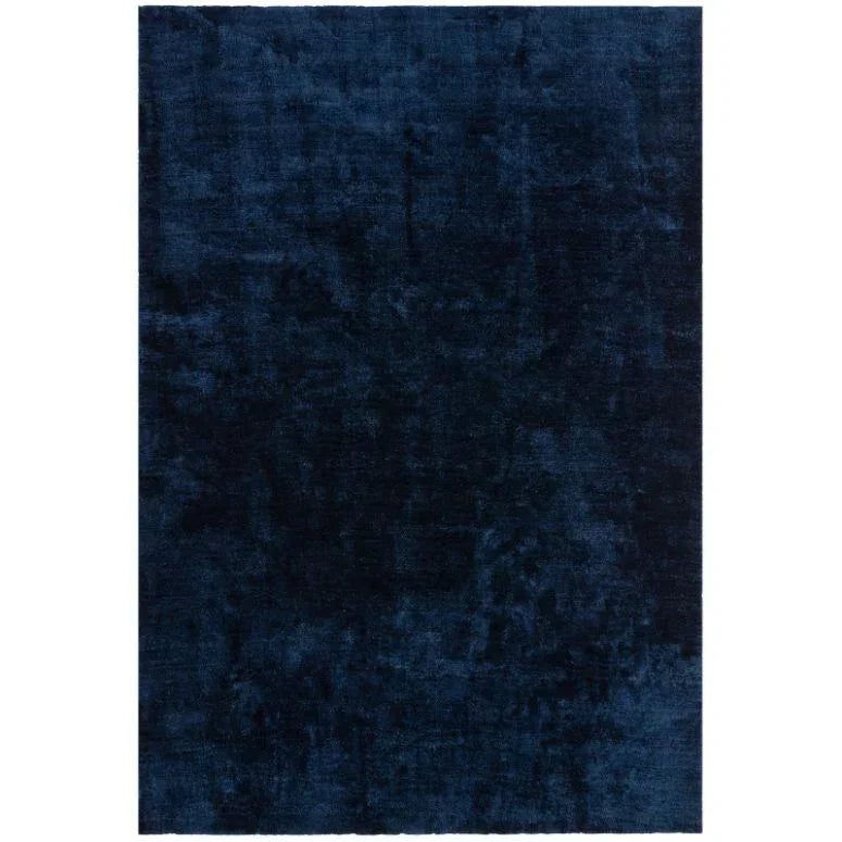 Rectangular dark blue velvet rug with subtle textured pattern