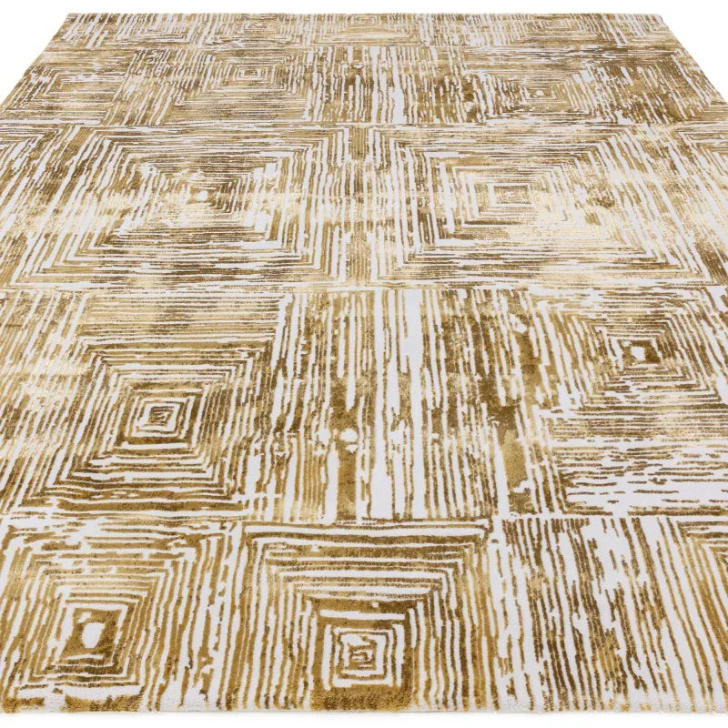 Gold and cream geometric area rug with square pattern and textured finish