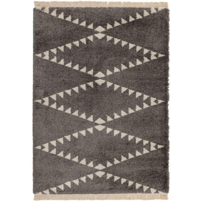 Grey area rug with cream geometric zigzag pattern and fringed edges