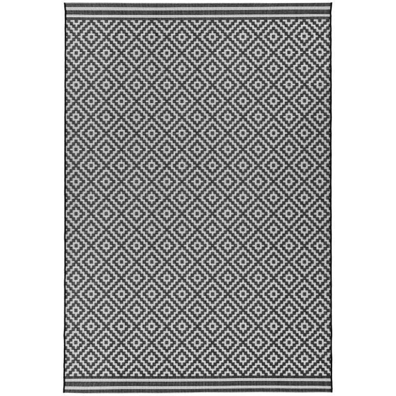 Black and white geometric patterned area rug with diamond motif and striped borders